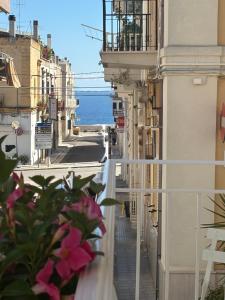 a view of a street with buildings and the ocean at DELL'EDERA Luxury Home in Polignano a Mare