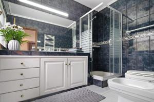 a bathroom with a sink toilet and a shower at Casa Carmen in Cabouco +40 photos