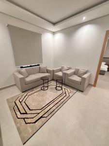 a living room with a couch and a table at ايراد للشقق المفروشه in Dammam +1 photo