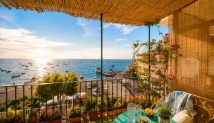 a balcony with a view of the ocean at AMORE RENTALS - Casa Raffi in Positano