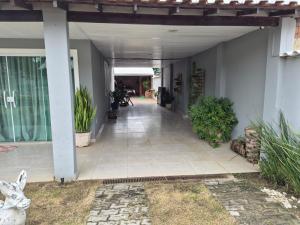 a hallway of a house with plants on it at Casa da Val in Saquarema