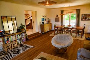 a living room with a table and a dining room at Amama Baita in Urrugne