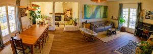 a living room with a table and a couch at Amama Baita in Urrugne