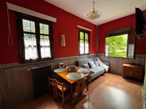 a living room with a table and a couch at Apartamentos Dos Aguas in Aguasmestas