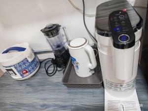 a counter with a blender and other appliances on it at JN Villa Homestay 5 Bedroom house, Near Airport Kota Kinabalu in Donggongon