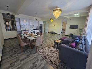 a living room with a couch and a table at Goldsip lounge in Addis Ababa