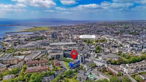 an aerial view of a city with a red marker at Snoozles Galway City Centre in Galway