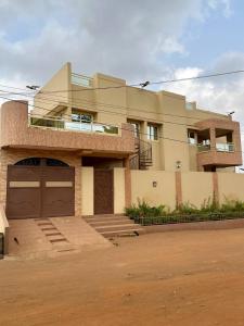 a large house with a large garage in front of it at Residence EBENE in Kika