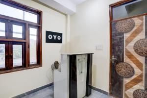 a elevator in a room with a door at Hotel O Kalka in Faridabad