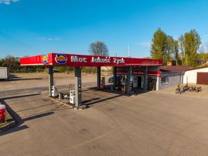 a mcdonalds gas station in a parking lot at Motel Ketmia in Plecka Dąbrowa +49 photos