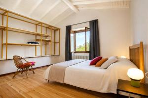 a bedroom with a large bed and a window at Villa Amore in Cannobio +37 photos
