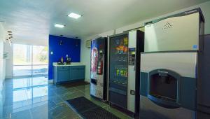 a room with two video game machines on the wall at Xpress Inn & Extended Stays in Marshall