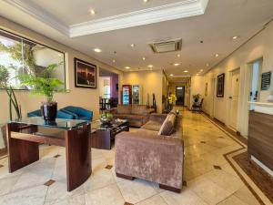 a living room with a couch and a table at Apartment 22 - Jundiaí in Jundiaí