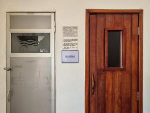 a door with a sign on it next to at Apartment 22 - Jundiaí in Jundiaí +16 photos