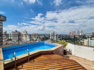 a swimming pool on the roof of a building at Apartment 22 - Jundiaí in Jundiaí