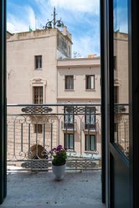 a view of a building from a window at Chez Moi in Trapani