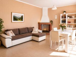 a living room with a couch and a table at Casa vacanze "Ellen" - AAUT in Bianchi