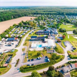 an aerial view of a park with a lot of cars at Séjour à litteau in Litteau