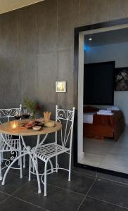 a dining room with a table and chairs and a bed at Luxury Resort in Licola