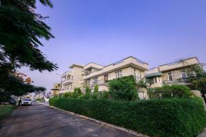 a row of apartment buildings on a street at IT City Luxe Homestay-Secure & Comfortable Stay in Mohali in Mohali