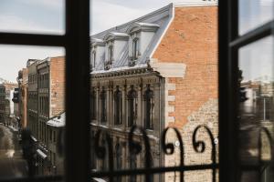 a view of a building from a window at CORNER - Luxury Serviced Apartments in Montreal