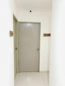 a door in a room with two signs on it at Hotel Galicia in Montería