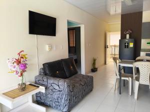 a living room with a couch and a table at VILLA IRIS in Santa Marta