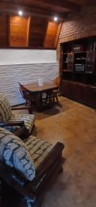 a living room with a table and a couch at Monoambiente in Ezpeleta