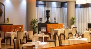 a dining room with white tables and chairs at Best Western Hotel Palace Lucera in Lucera