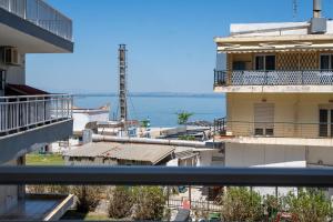 a view of the ocean from a balcony of a building at Maria Apartments in Perea