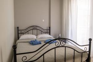 a bed with two towels on it in a bedroom at Maria Apartments in Perea