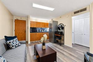 a living room with a couch and a table at Executive Center 1604 in Honolulu
