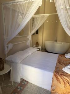 a bedroom with a bed and a bath tub at Scaramella room s in Salerno