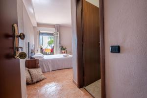 an open door to a bedroom with a bed at Hotel Ristorante L'Orizzonte in Le Castella