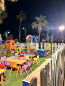 a play park with tables and chairs and a playground at 2BR Sea View Chalet Porto sokhna in Ain Sokhna