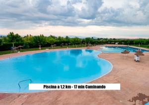 a large swimming pool with blue water at Ruralux Sierra Castril in Huéscar