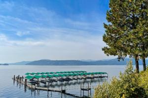 a row of tables on a dock in the water at Resort City Inn Coeur d Alene in Coeur d'Alene +16 photos
