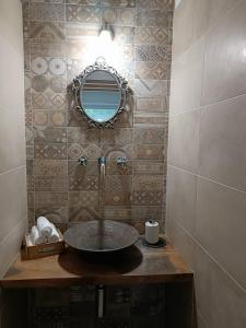 a bathroom with a sink and a mirror at B&B La Piccola Lepre in Acqui Terme +26 photos