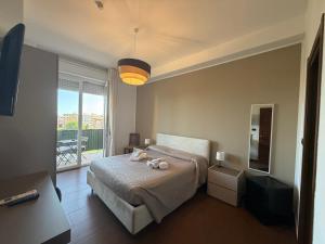 a bedroom with a bed with two stuffed animals on it at Panoramic Rooms in Syracuse