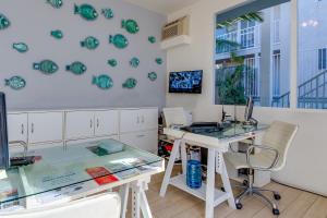 an office with a desk and a computer on a wall at Bayside Hotel in Los Angeles