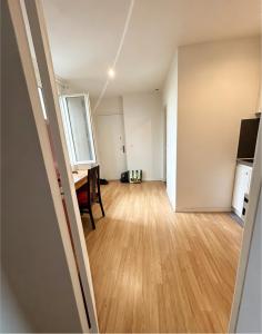 an empty living room with a desk and a table at Studio Maisons-Alfort in Maisons-Alfort +22 photos