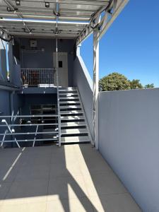 a view from the balcony of a building with stairs at Suite Privativa in Dom Pedrito