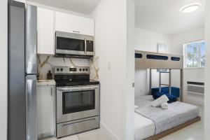 a kitchen with a stainless steel stove and refrigerator at 11432 Lincoln Blvd in Richmond Heights