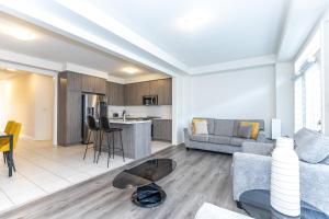 a living room with a couch and a table at Home in Waterdown in Hamilton