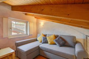 a living room with a couch and a window at Palazzo Gritti in Morcote +111 photos