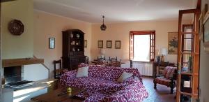 a living room with a couch and a fireplace at CasaLalla - Natura&Relax in Cusano Mutri +34 photos