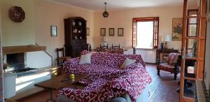a living room with a couch and a table at CasaLalla - Natura&Relax in Cusano Mutri