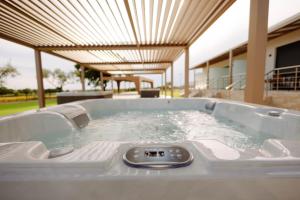 a jacuzzi tub on a patio at Aura Otto Luxury Living in Alexandroupoli