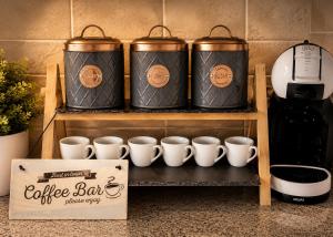 a group of coffee cups sitting on a shelf at Lomond Castle Penthouse in Luss +31 photos