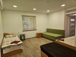 a hospital room with two beds and a window at Centro bustas in Kėdainiai